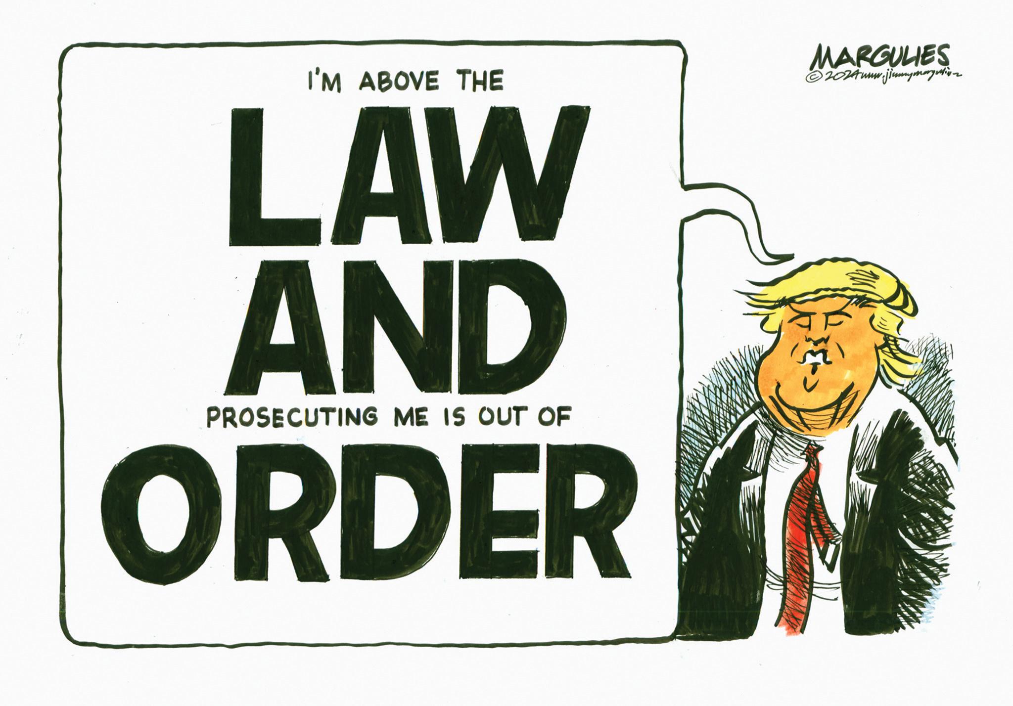 Signage OCR: I'M ABOVE THE LAW AND PROSECUTING ME IS OUT OF ORDER MARGULIES ©2024www.jimmymargutiv I'M ABOVE THE LAW AND PROSECUTING ME IS OUT OF ORDER MARGULIES © 2024www.jimmymargutiv