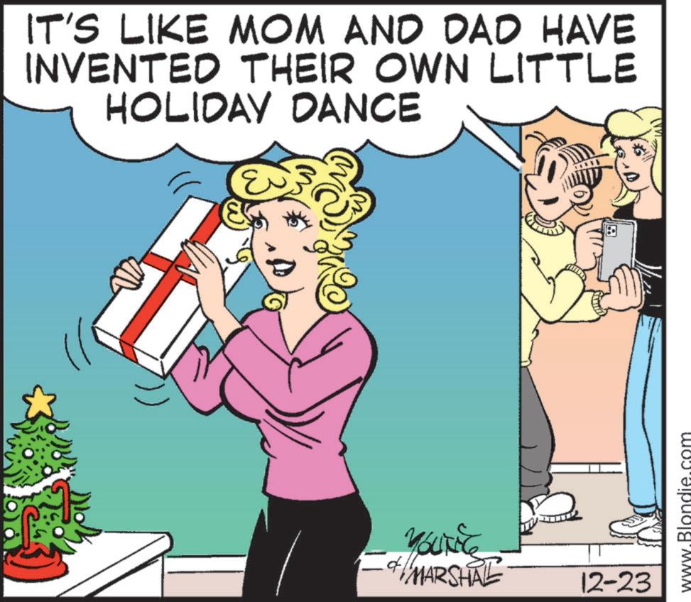 Photo caption OCR: IT'S LIKE MOM AND DAD HAVE INVENTED THEIR OWN LITTLE HOLIDAY DANCE MARSHAL 12-23 www.Blond IT'S LIKE MOM AND DAD HAVE INVENTED THEIR OWN LITTLE HOLIDAY DANCE MARSHAL 12-23 www.Blond