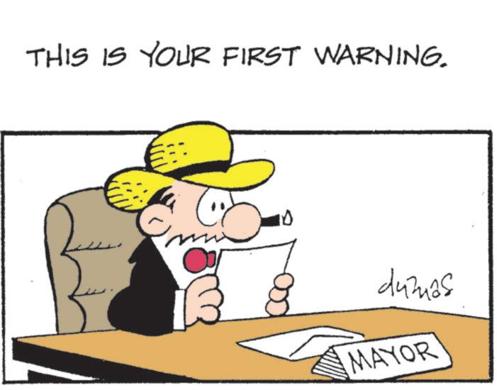 Photo caption OCR: THIS IS YOUR FIRST WARNING. 10 dumas MAYOR THIS IS YOUR FIRST WARNING . 10 dumas MAYOR